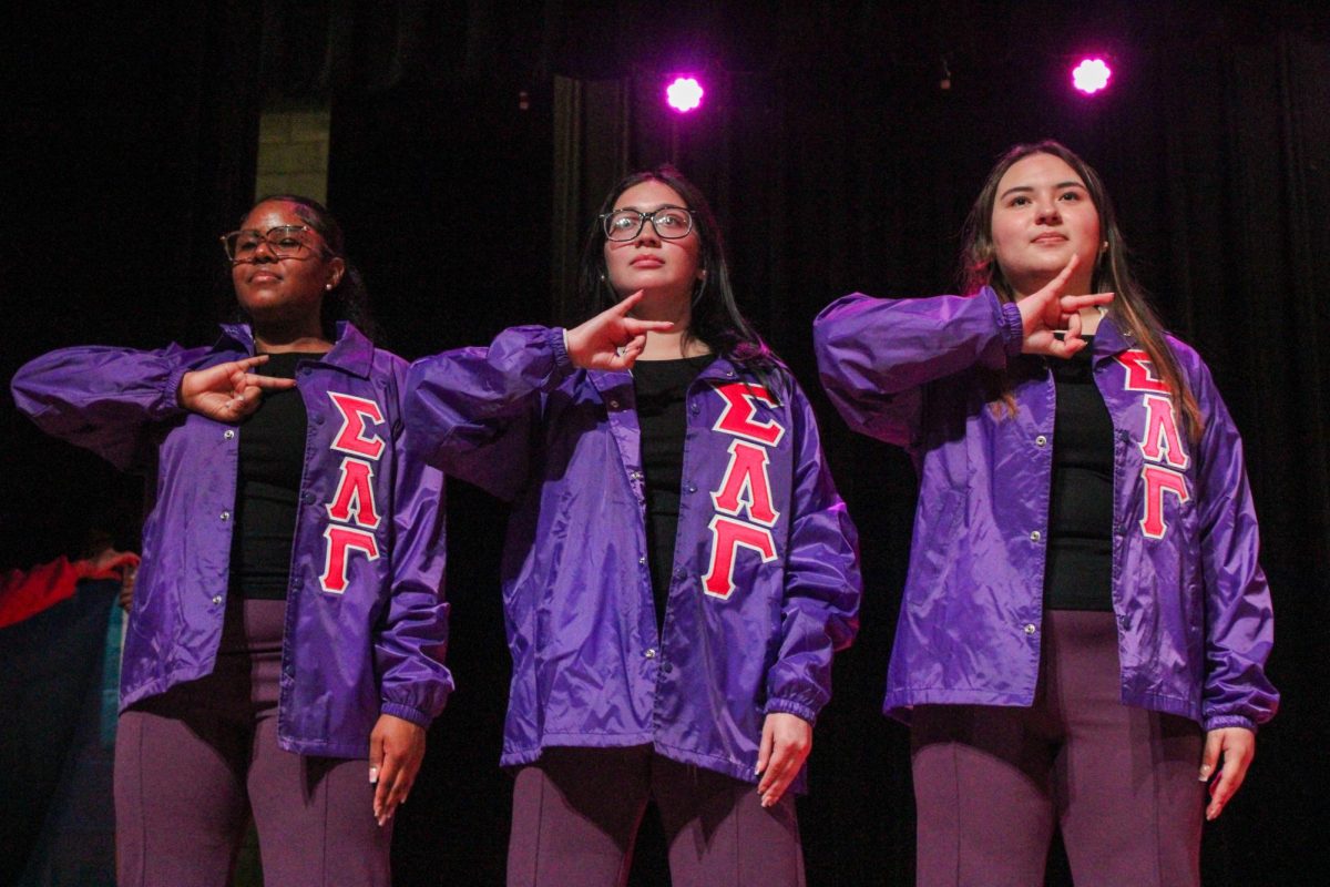 New members Yavilka Peñaloza, Sofia Carrizales and Jenifer Garduno of the Associate Chapter of Sigma Lambda Gamma Sorority, Inc. pose with their letters after their reveal Friday night, April 18, 2026.