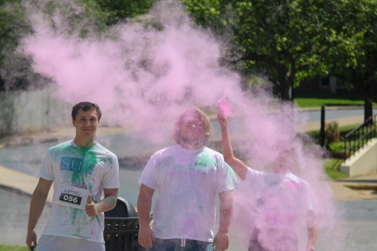 Austin Peay State University students throw powder in the air before the color run, Sunday afternoon, April 19, 2026.
