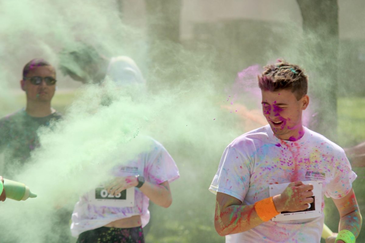 Austin Peay State University student powers past the colored powder to finish the color run, Sunday afternoon, April 19, 2026.