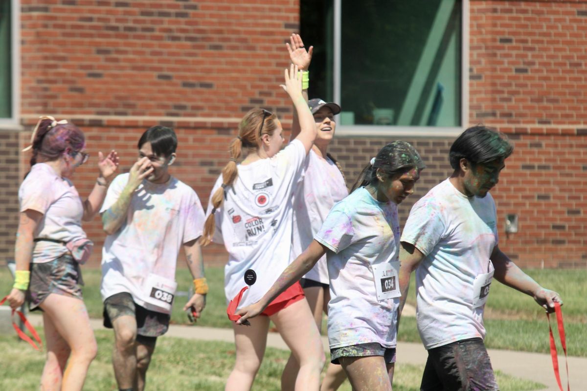 Austin Peay State University students high five each other after the color run, Sunday afternoon, April 19, 2026.