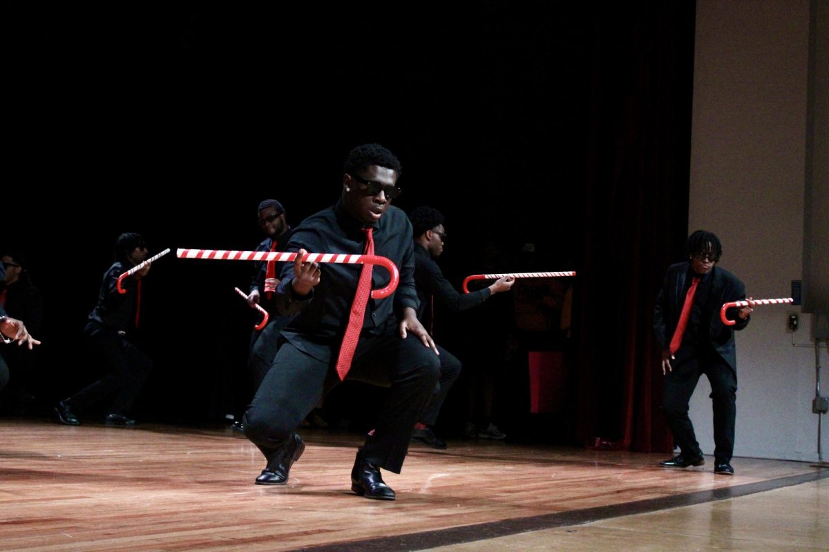 Theta Beta chapter of Kappa Alpha Psi members shimmy with their canes during the slow round of the NPHC Stroll Off on Friday, April 24, 2026.