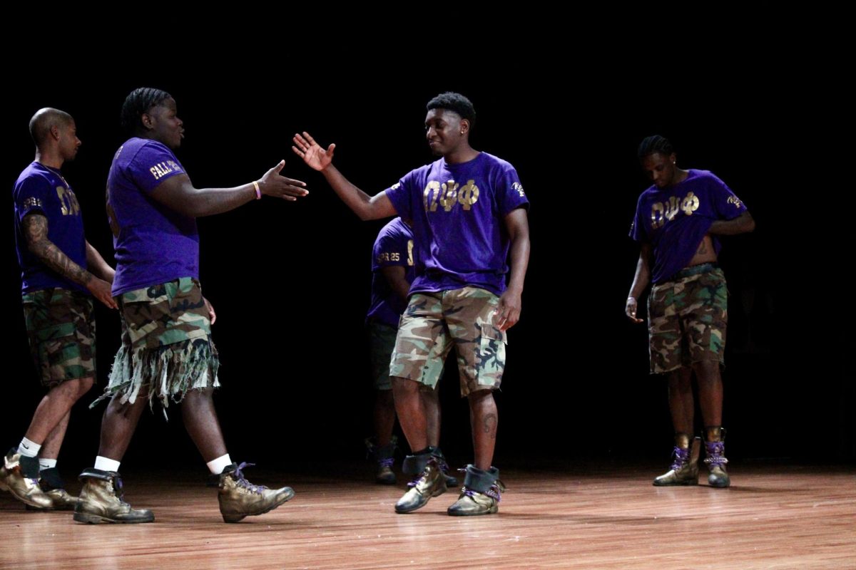 Rho Kappa chapter of Omega Psi Phi members shake hands before the fast round of the NPHC Stroll Off on Friday, April 24, 2026.