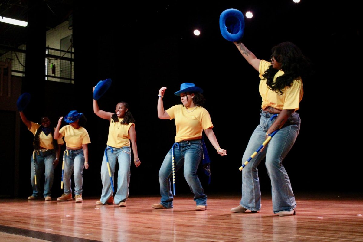 Nu Zeta chapter of Sigma Gamma Rho members tip their hats during the freestyle round of the NPHC Stroll Off on Friday, April 24, 2026.