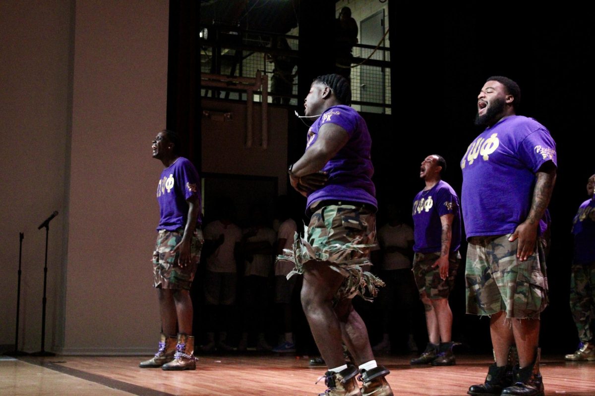 Rho Kappa chapter of Omega Psi Phi members sing during the freestyle round of the NPHC Stroll Off on Friday, April 24, 2026.