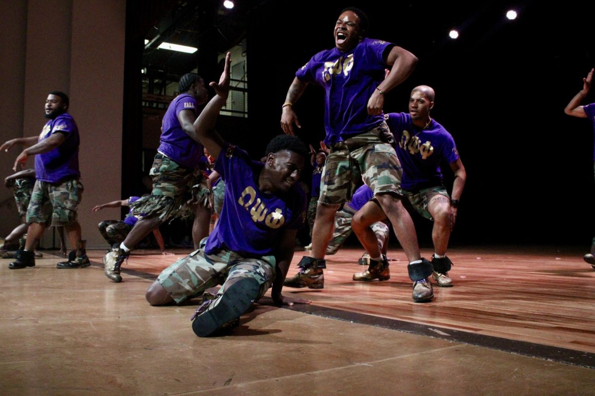 Rho Kappa chapter of Omega Psi Phi members split and bark during the freestyle round of the NPHC Stroll Off on Friday, April 24, 2026.
