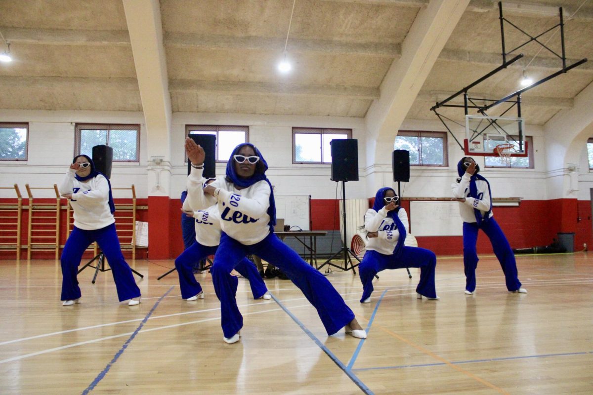 New members of the Gamma Nu chapter of Zeta Phi Beta Sorority, Inc. lower into a squatting position during their reveal on Monday, April 27, 2026.