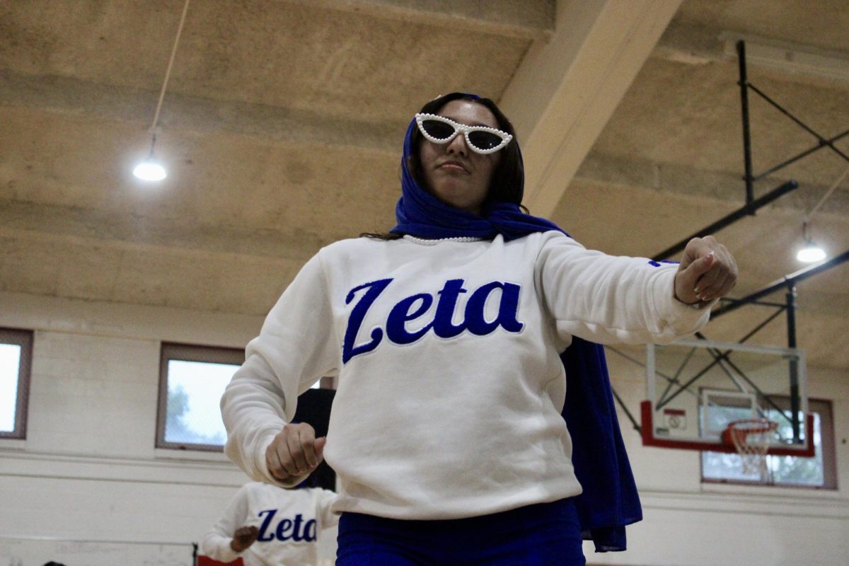 New member Mya Saunders of the Gamma Nu chapter of Zeta Phi Beta Sorority, Inc. dances front and center before her reveal on Monday, April 27, 2026.