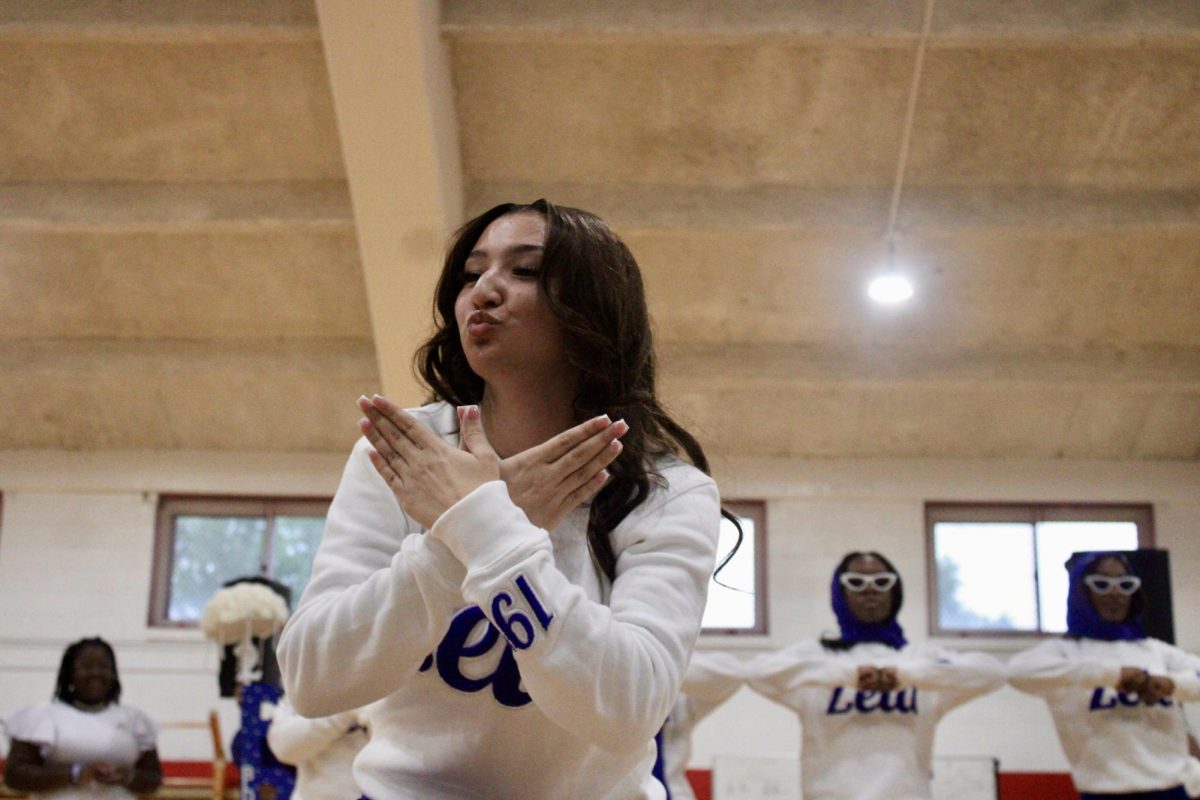 New member Mya Saunders of the Gamma Nu chapter of Zeta Phi Beta Sorority, Inc. holds up a dove and blows a kiss to her family during her reveal on Monday, April 27, 2026.