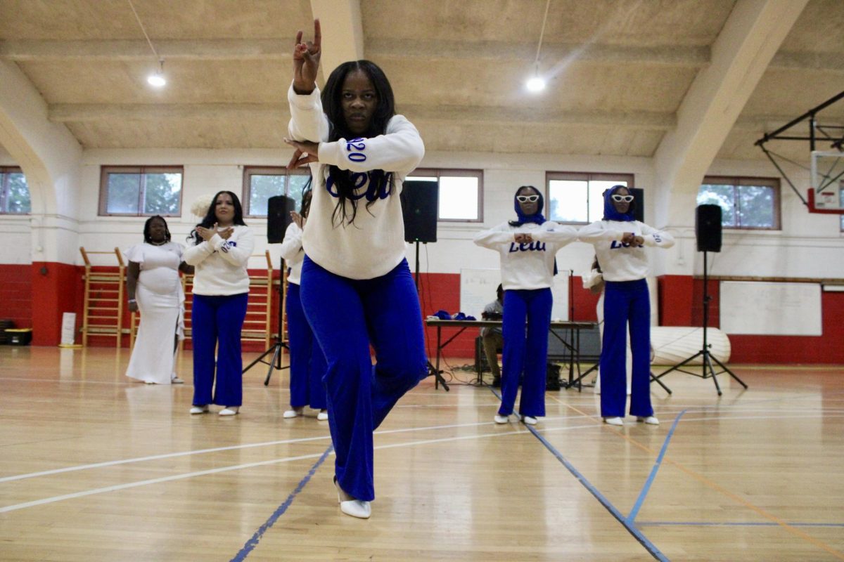 New member Rakyiah Wicks of the Gamma Nu chapter of Zeta Phi Beta Sorority, Inc. holds a pose on one leg during her reveal on Monday, April 27, 2026.