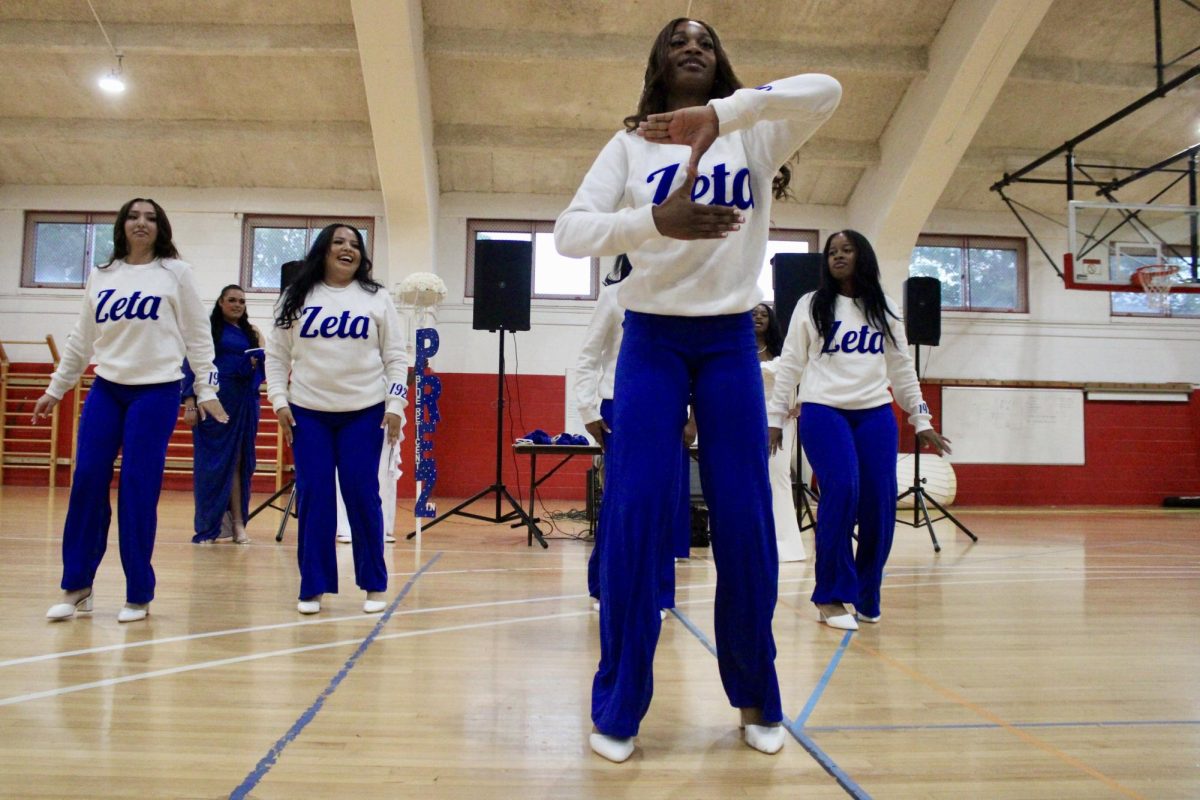 New member Chasitie Mossman of the Gamma Nu chapter of Zeta Phi Beta Sorority, Inc. forms a “Z” with her hands during her reveal on Monday, April 27, 2026.